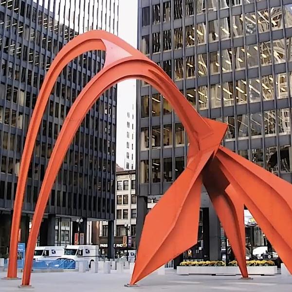Alexander Calder's monumental orange sculpture Flamingo in the urban plaza
